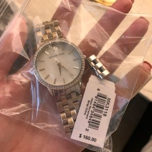 Michael Kors model MK3118 in silver. Brand new.